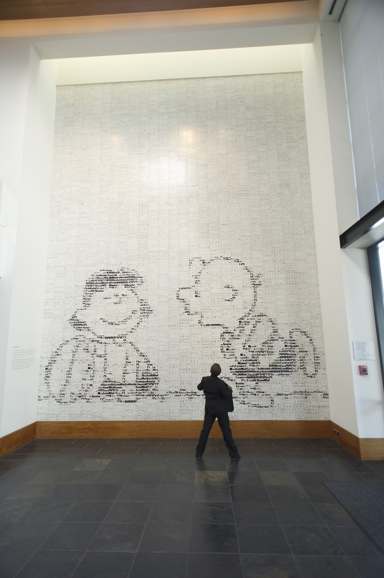 This mural is huge and amazing in person. It is made out of comic strips printed on horizontal ceramic tiles.