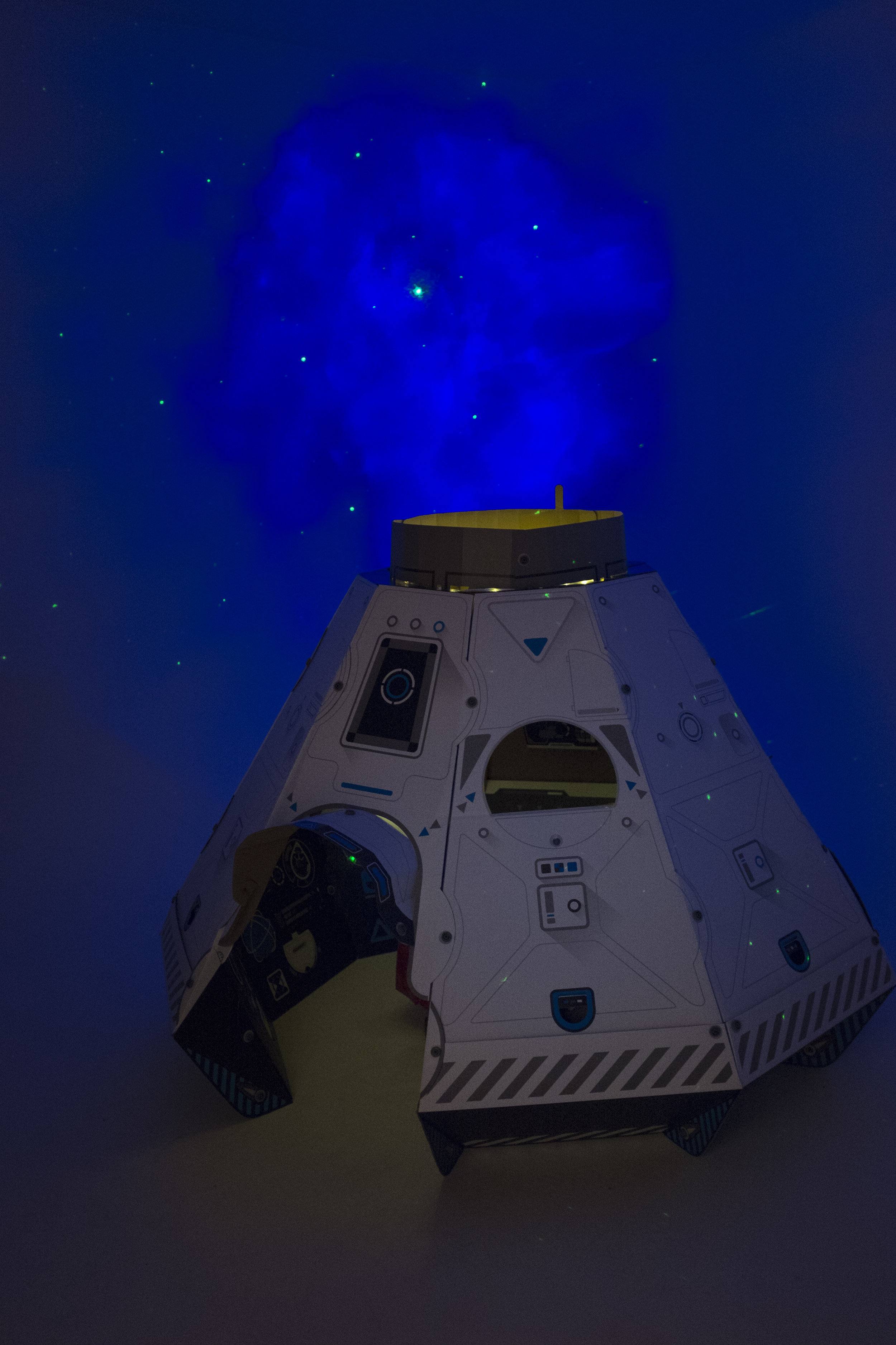 We have thick black theater curtains on a track around the infinity wall, and we took out all of the lightbulbs in the track lighting over the studio area so that it'd be completely dark except for the stars.