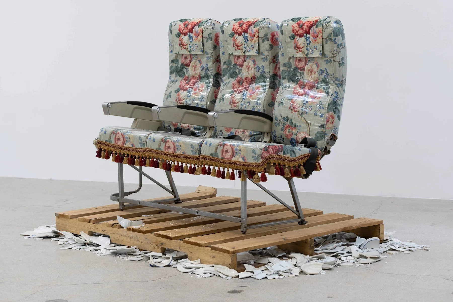 Enigma of Arrival in Four Sections: Section III: Disembarkment, 2020
Airline chair, fabric, plastic, broken ceramic plates on shipping pallet
60 x 84 x 48 inches / 152.4 x 213.4 x 121.9 cm

