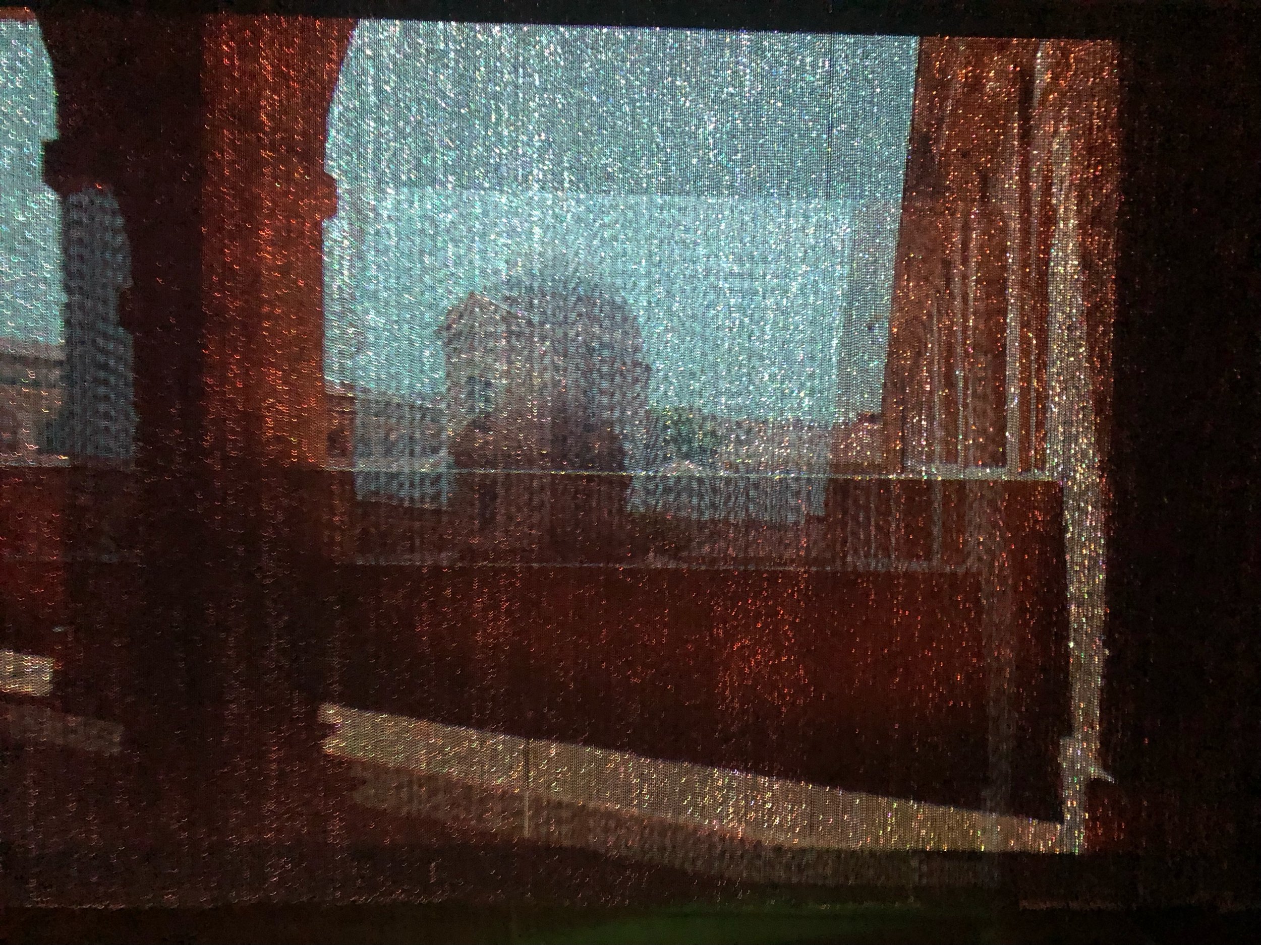 Video Installation shot from The Catalogue of Speculative Translations, metal bead curtain, video projector, 2024