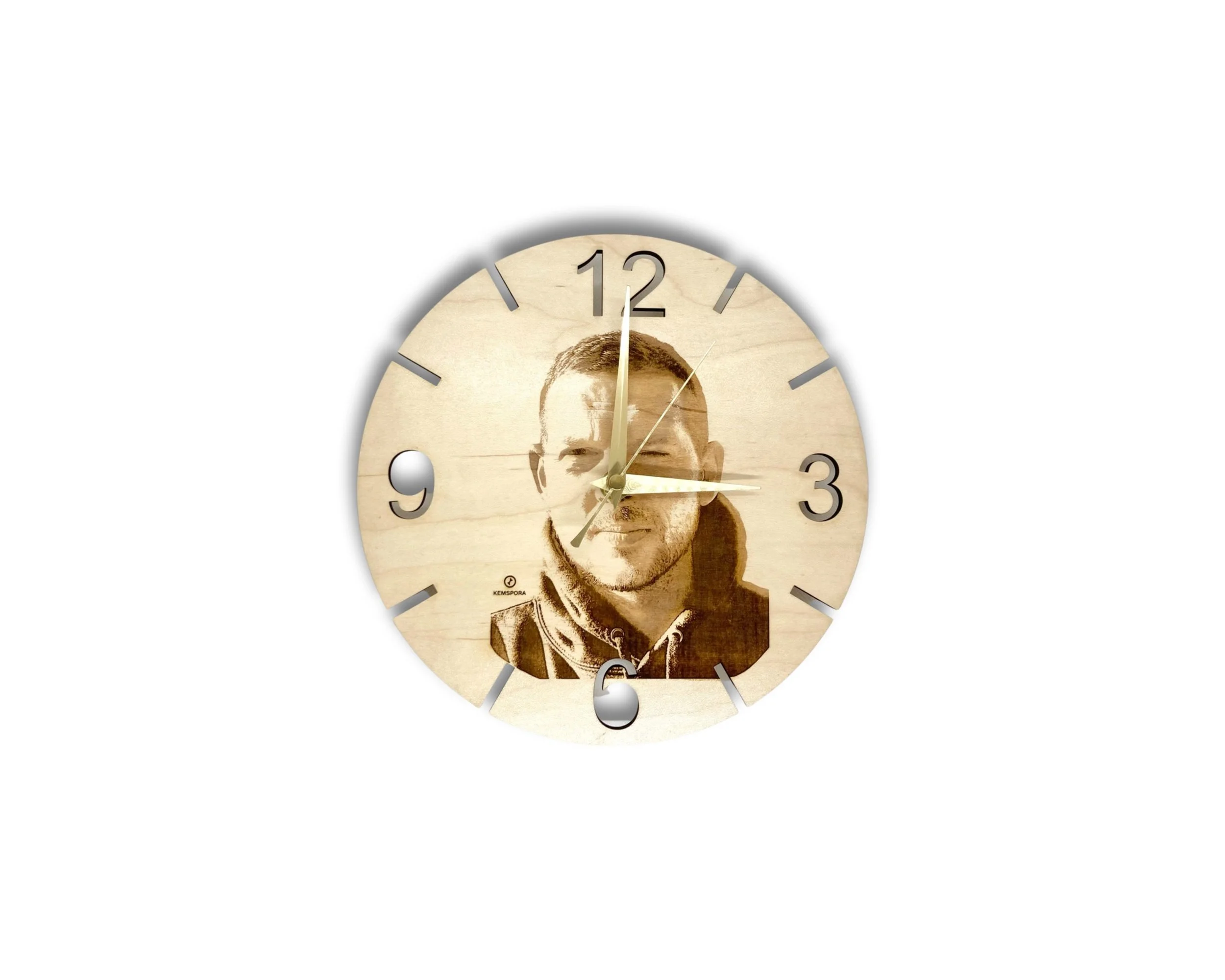 A Kemspora custom art laser engraving, on a uniquely stylish circular wooden clock face, of a man smiling, with short hair.
