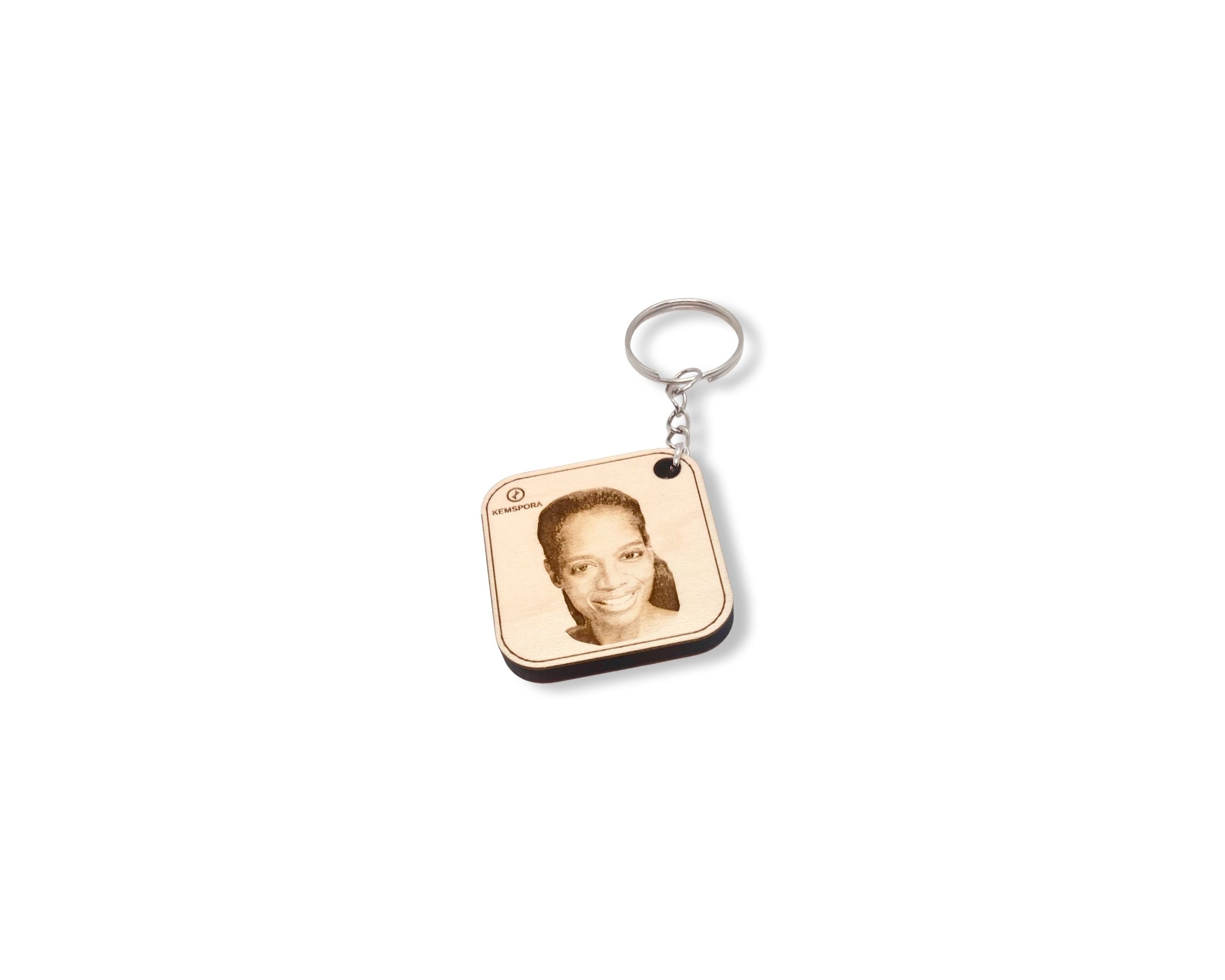 Kemspora custom art laser engraving, on a beautiful stylish square, wooden, keyring, of a woman with long hair smiling