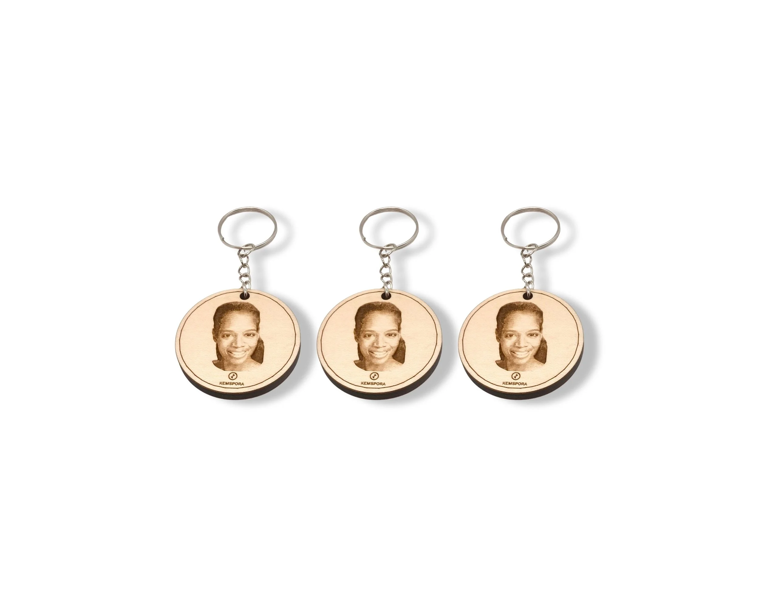 3 set of Kemspora custom art laser engraving, on a beautiful stylish circular, wooden, keyring, of a woman with long hair smiling