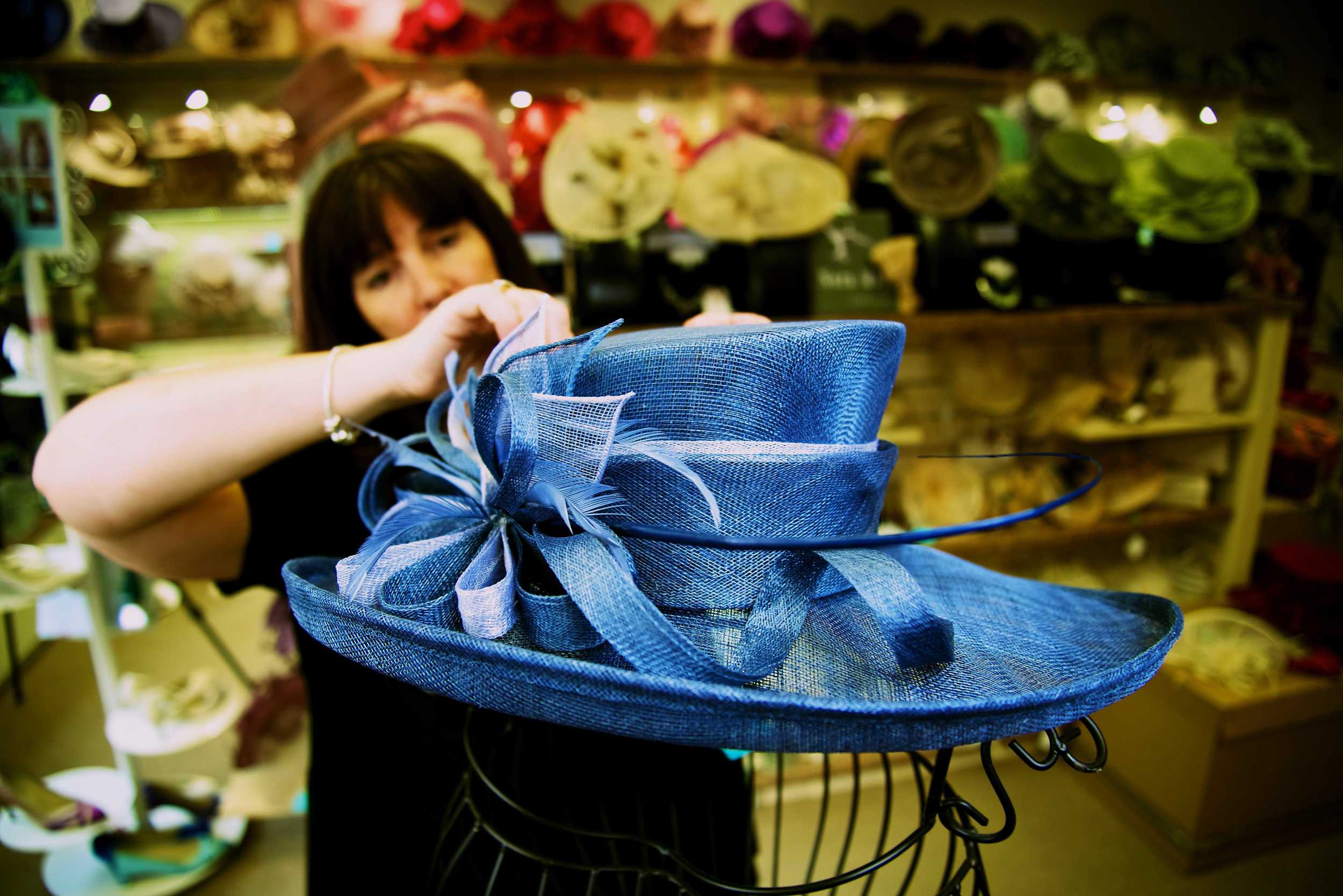 Tracy adding Finishing Touches to a Hat