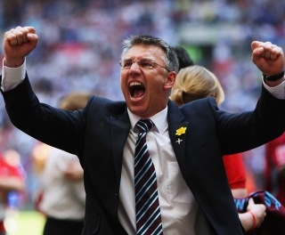 What a difference seven weeks makes: After losing to Luton in the Johnstone's Paint Trophy final seven weeks earlier, Adkins guides Scunthorpe to League 1 play off victory and a place in the Championship for the 2009/2010 season