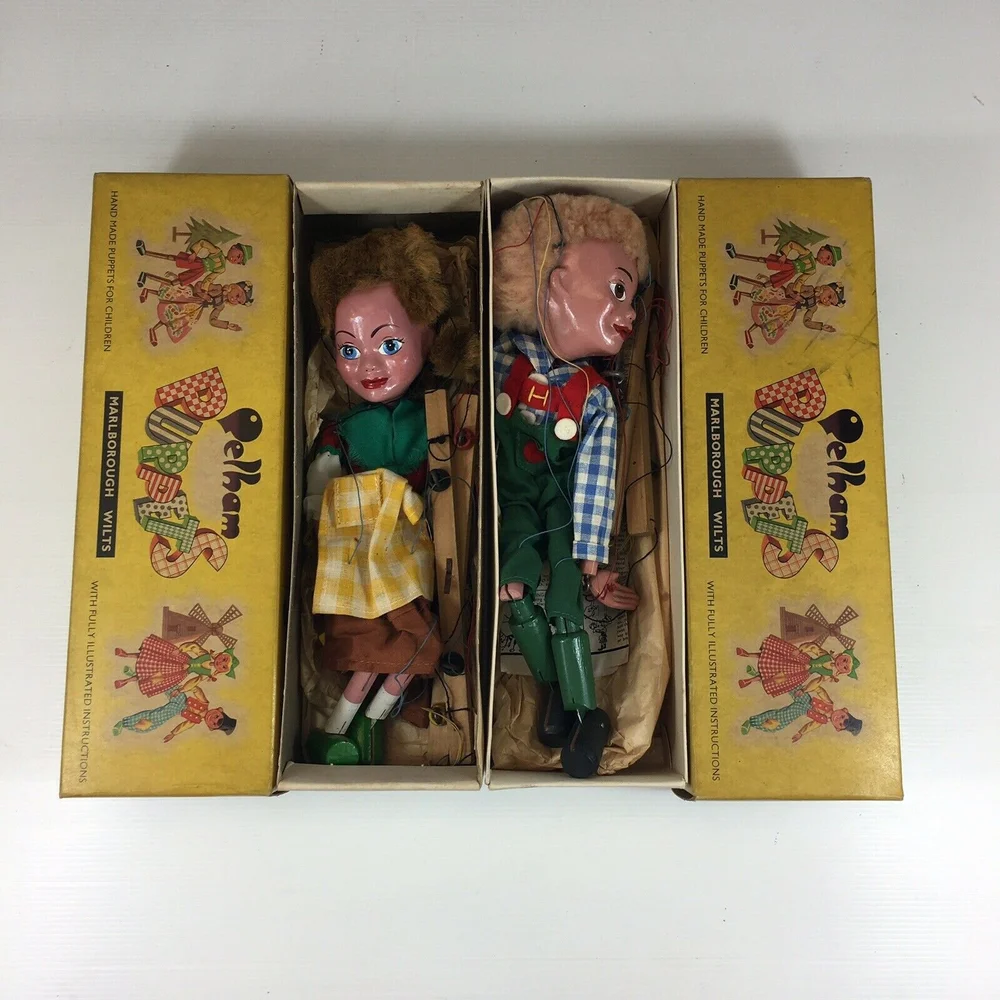 Four Pelham puppets, together with a Pelham puppet theatre - Mitzi