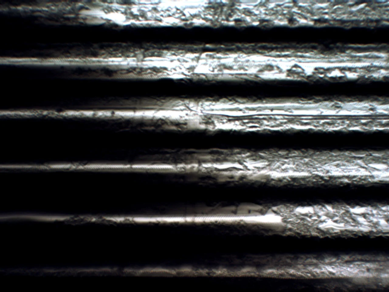  Closeup of printed half-tone pattern. Magnification levels range from x80 to x200. 