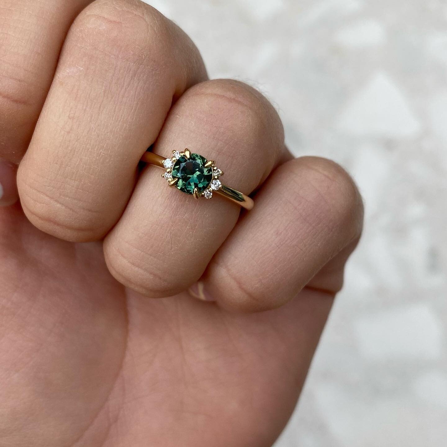 This green sapphire ring made its way to its new home today 🤍⁣
⁣
When I first spoke to R she wanted an eternity ring to celebrate the birth of her little boy, however things soon evolved and we ended up with this beauty, set in 18ct yellow gold with