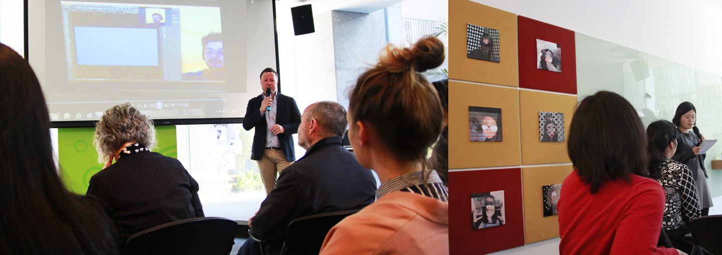 Dr. Claus Heimes presenting at German Consulate General, video on screen by Thi To Uyen Ly, artworks on the right by Annie Kurz