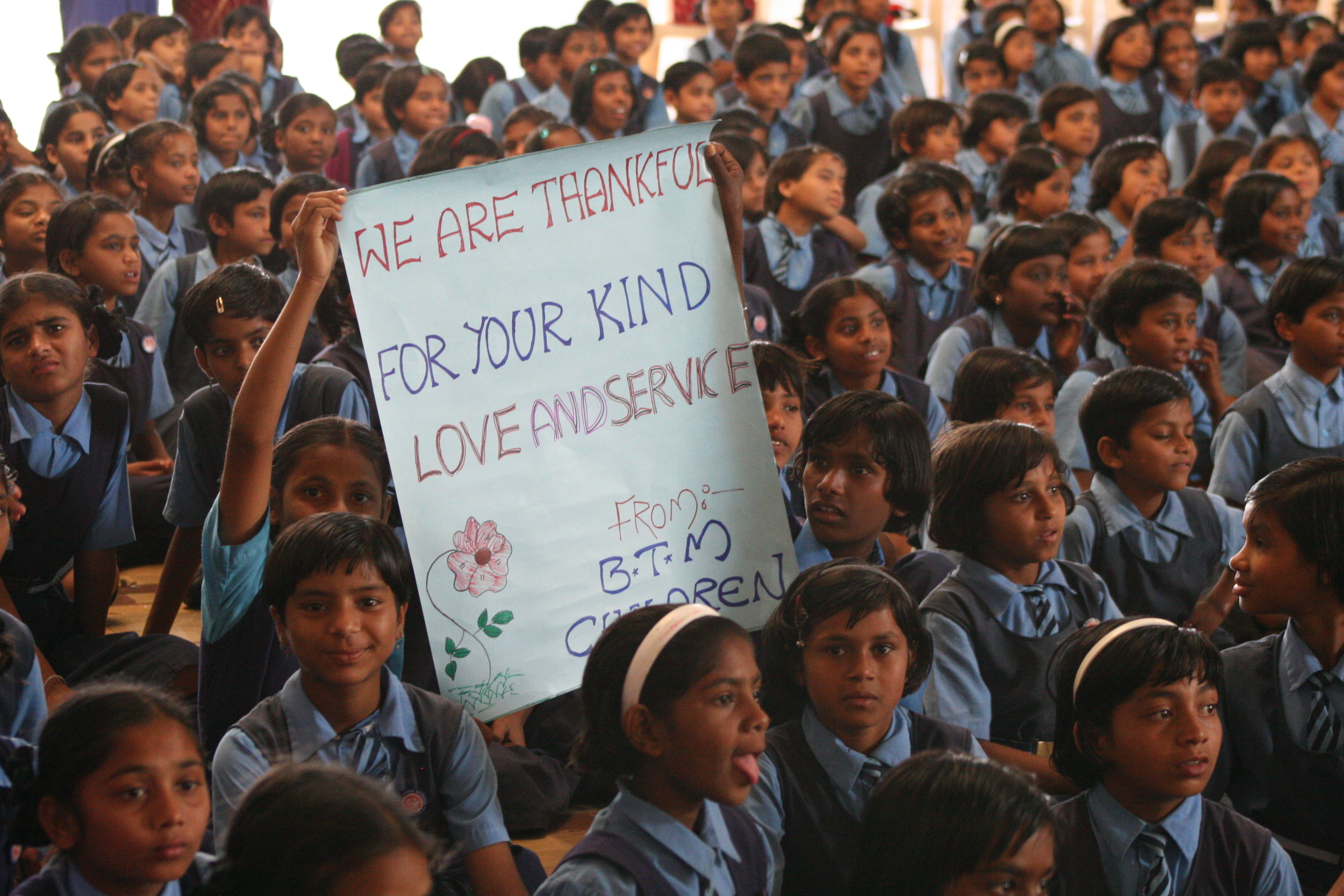 Children made signs for their American sponsors