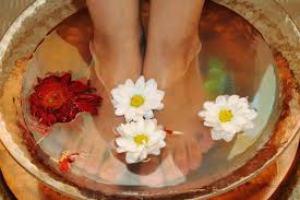 Are you suffering from dry cracked feet? I have the remedy for you. You will need half of a lemon or lime, epsom salt, a foot bath and olive oil. Add 2 teaspoons of epsom salt into your foot bath and soak your feet for about 10 minutes or more, pat feet dry then apply lemon or lime to your toes, don't forget your cuticles and heals. Then, saturate your feet with the olive oil. 1 tablespoon per foot should be plenty then. Put on your socks to help absorb the oil and not grease up your floors. Leave your socks on for at least thirty minutes or more. Great do do before a workout. You will love your feet after you shower. The lemon or lime is great for exfoliating the skin and brightening the nail bed and the olive oil is super hydrating. Once again inexpensive and effective!