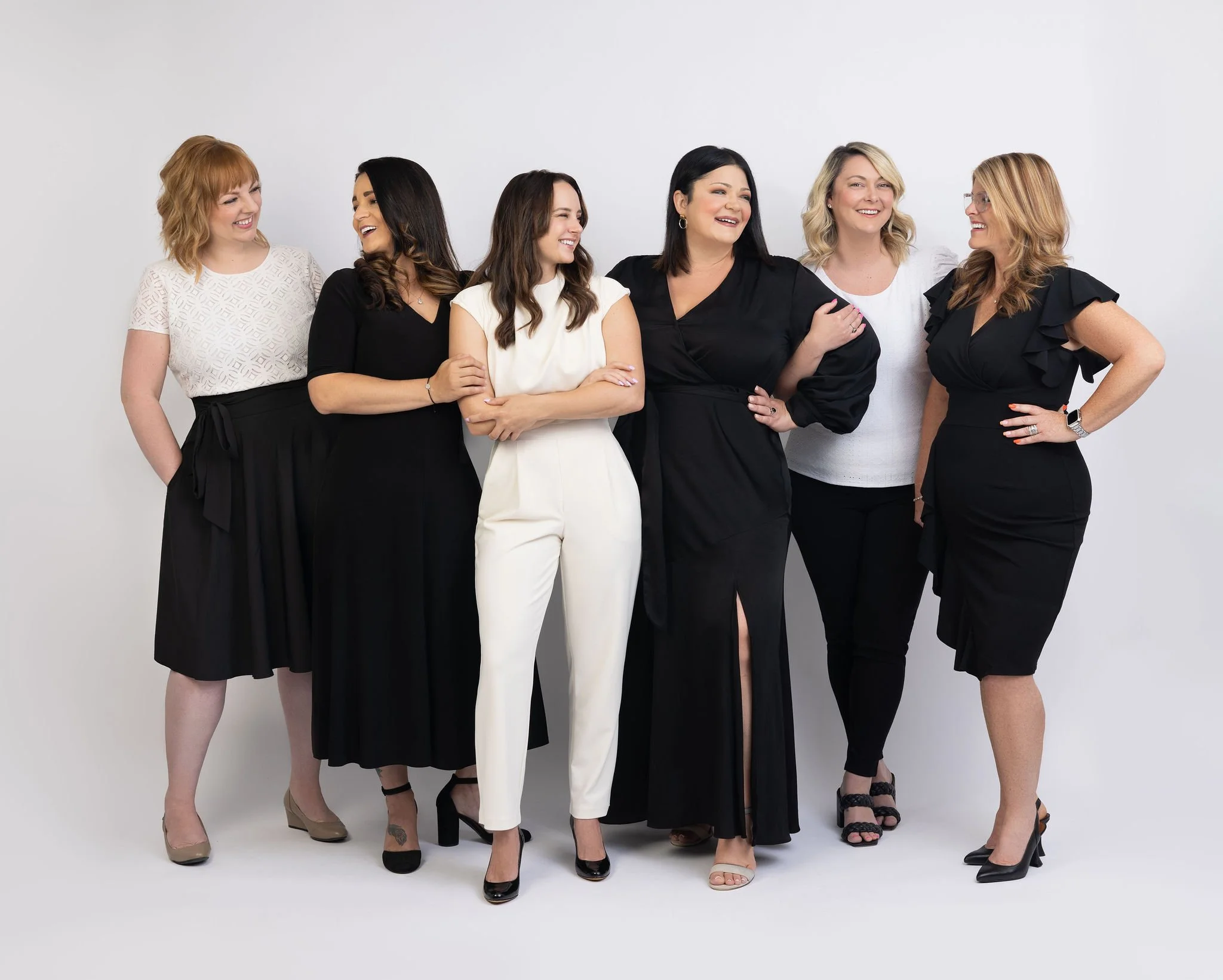 Professional group image of female real estate leaders, showcasing confidence, collaboration, and strong brand presence for marketing and media use.