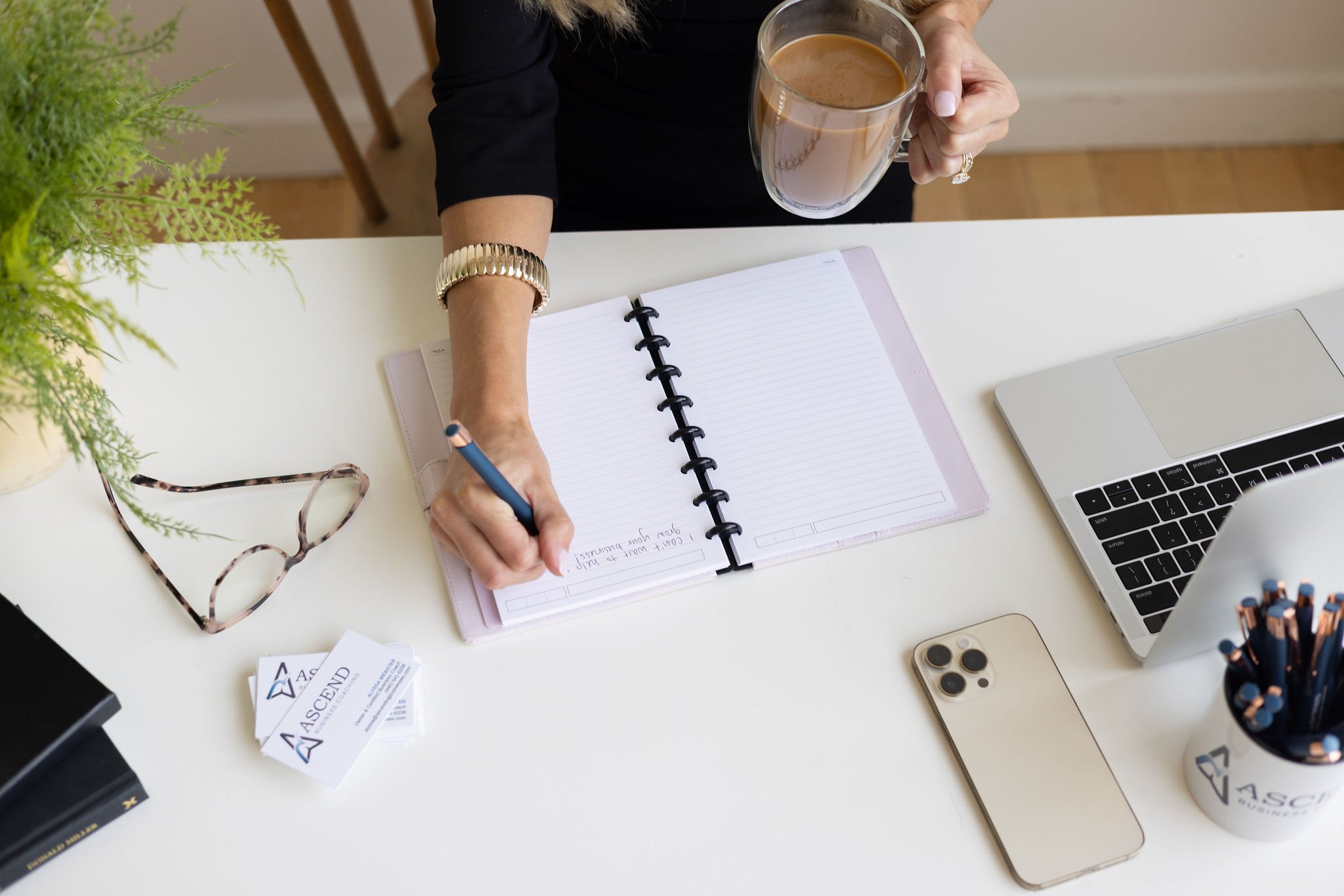 Detail shot of hands working at a desk, showcasing concentration, workflow, and authentic behind-the-scenes moments for brand storytelling.