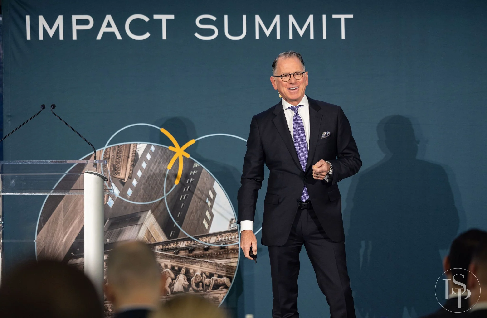 ceo founder speak John Wepler on stage action shot authentic real moment photo