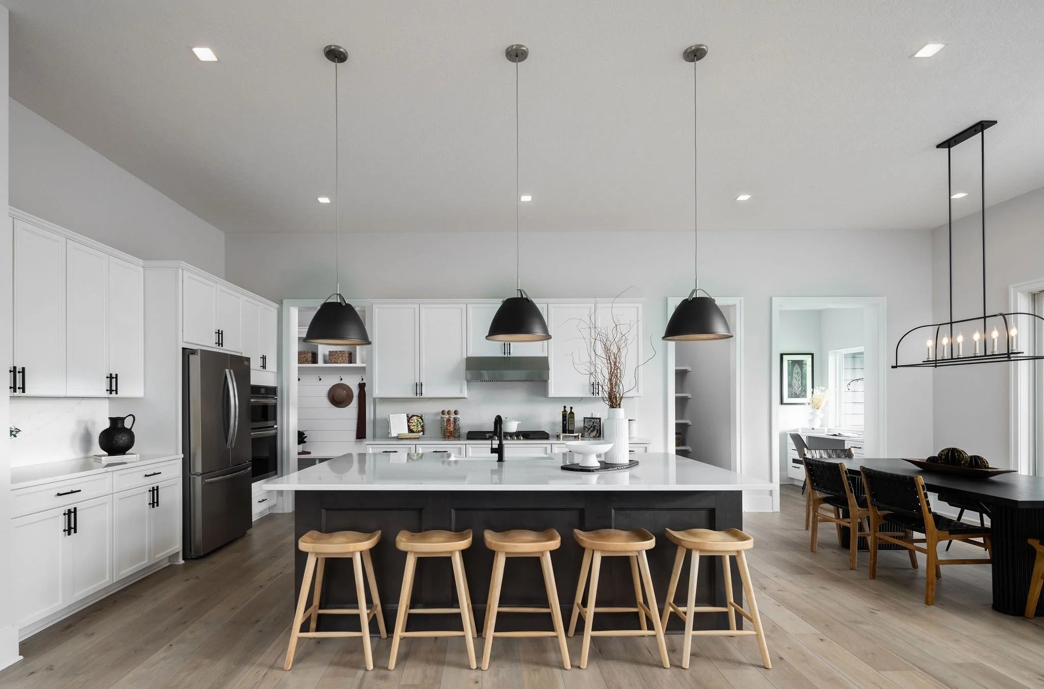 Architectural photography of a Schumacher Homes kitchen, showcasing modern design, layout, and interior finishes for real estate and builder marketing.