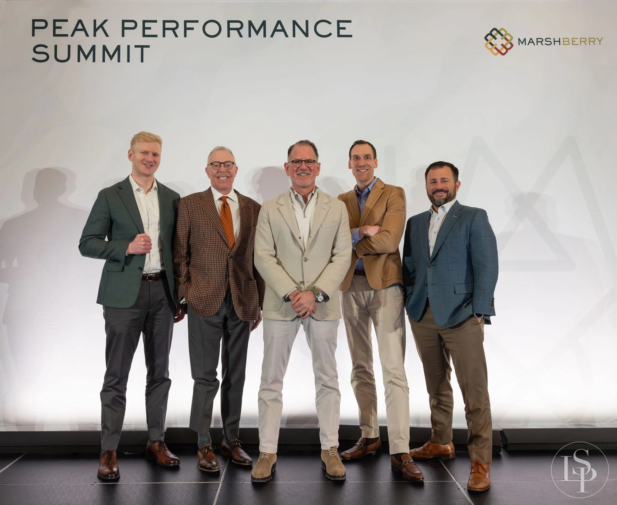 group photo of leadership team on stage event photography
