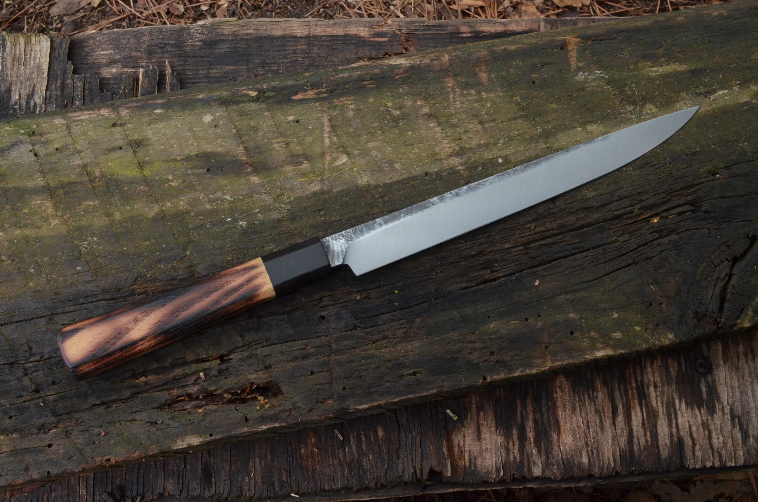 225mm Hybrid with Flame-grained black locust and blackwood octagonal handle. Retained filemarks.