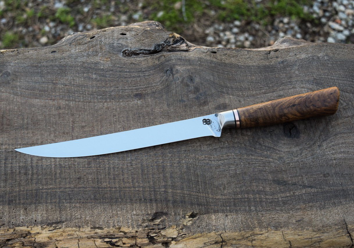  8.25" Integral Fillet with Forge Finish. Western Chestnut Handle with a Copper Spacer. 