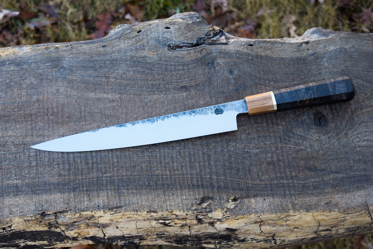  9.5" Hidden Tang Slicer with Forge Finish. Octagonal Black Maple Handle with Chestnut Ferrule and Brass Spacer.  