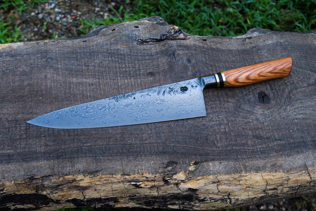  10” Integral Damascus French Chef with Forge Finish. Western Heart Pine Handle with Brass and Blackwood Spacers. 