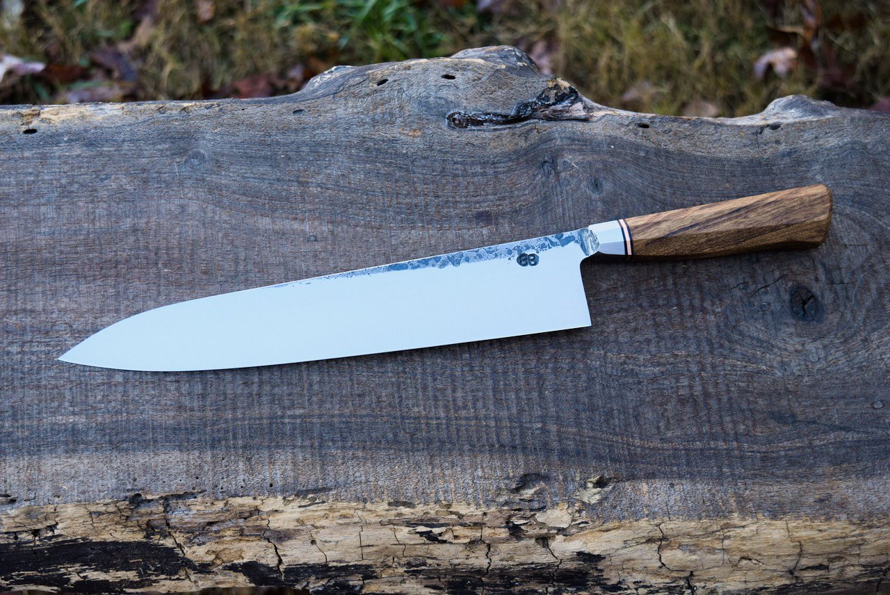  270mm Integral Bullnose Gyuto with forge finish. Westernized Octagonal Chestnut handle with a copper spacer. 