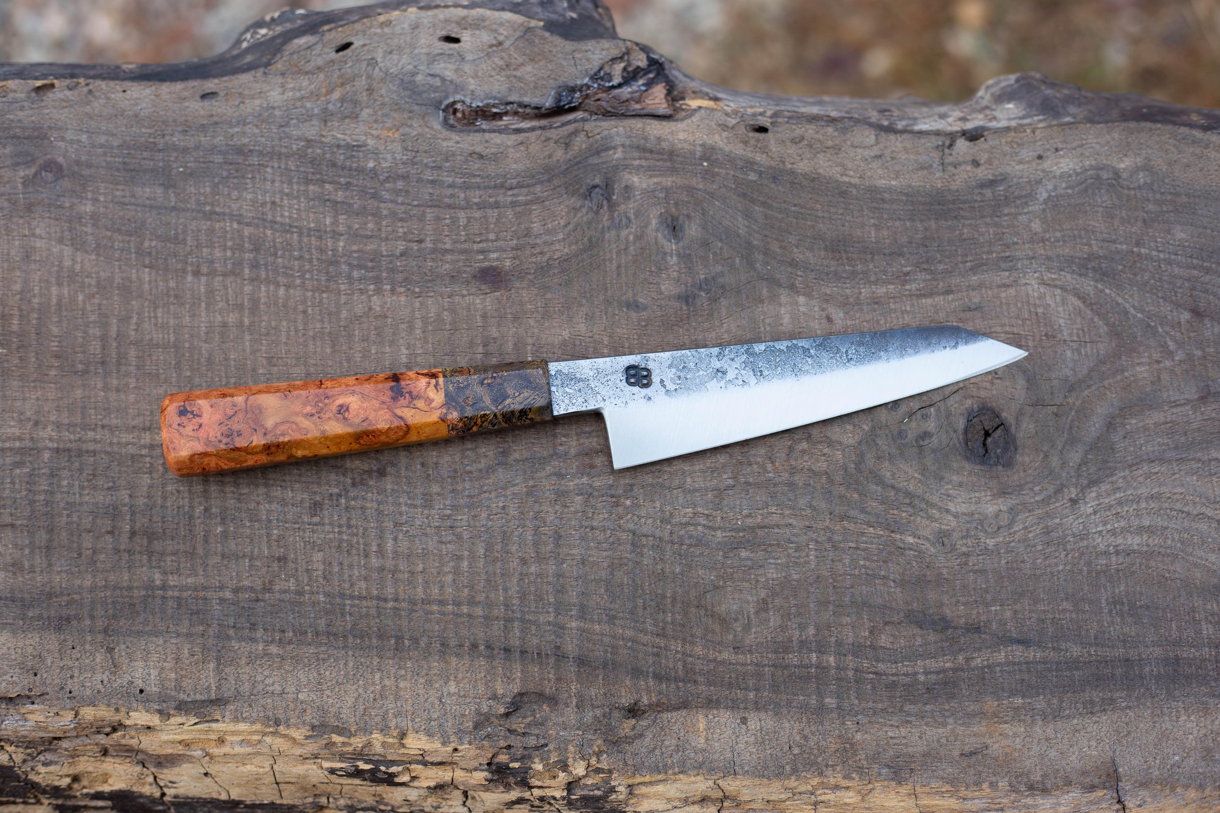  140mm Hidden-Tang Honesuki with Forge Finish. Octagonal Cherry Burl Handle with a Black Cherry Burl Ferrule. 