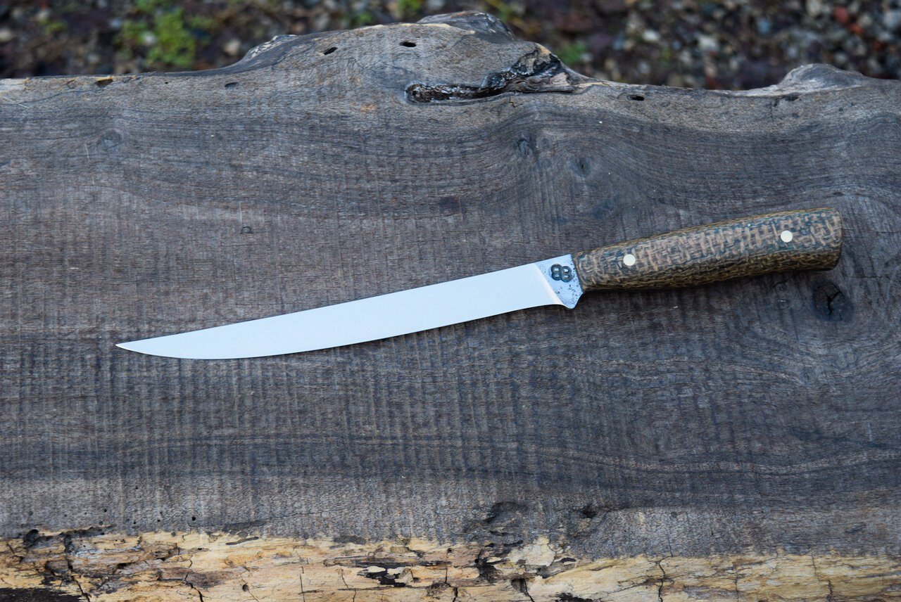  7.25” Full-Tang Boning/Fillet with Forge Finish. Western Coffeebag Laminate Handle with Brass Pins. 