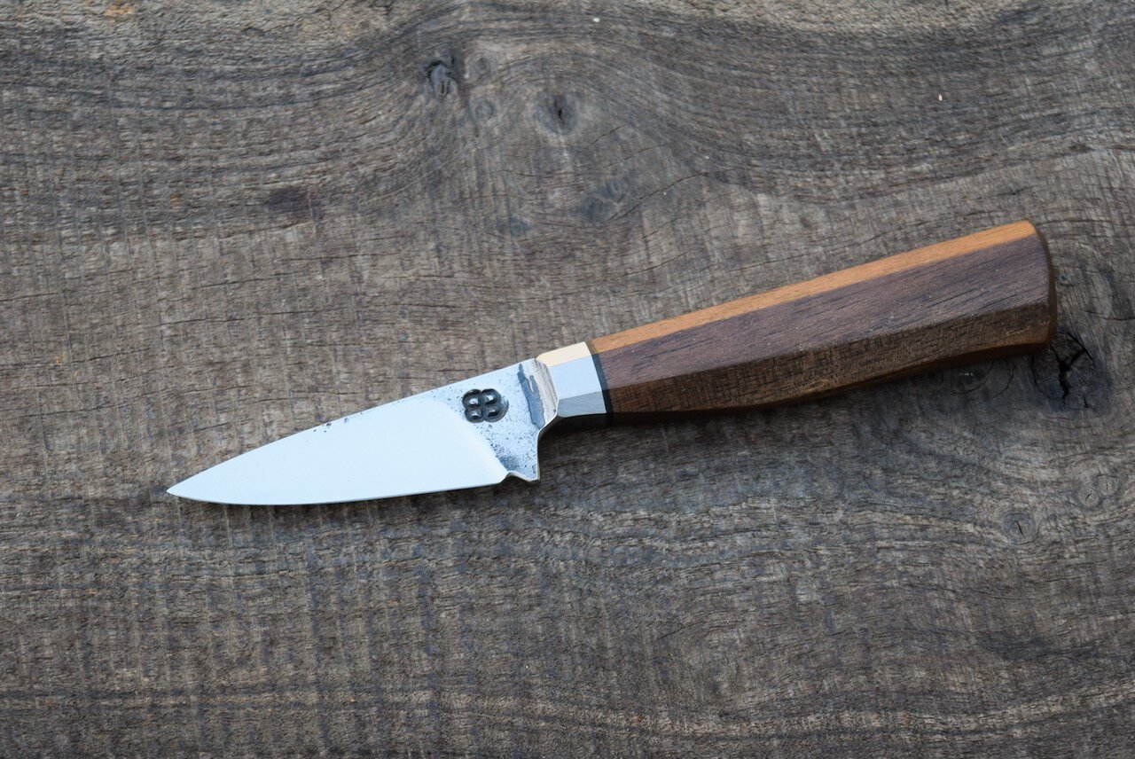  2.5” Integral Pocket with Forge Finish. Westernized Octagonal Walnut Handle.  