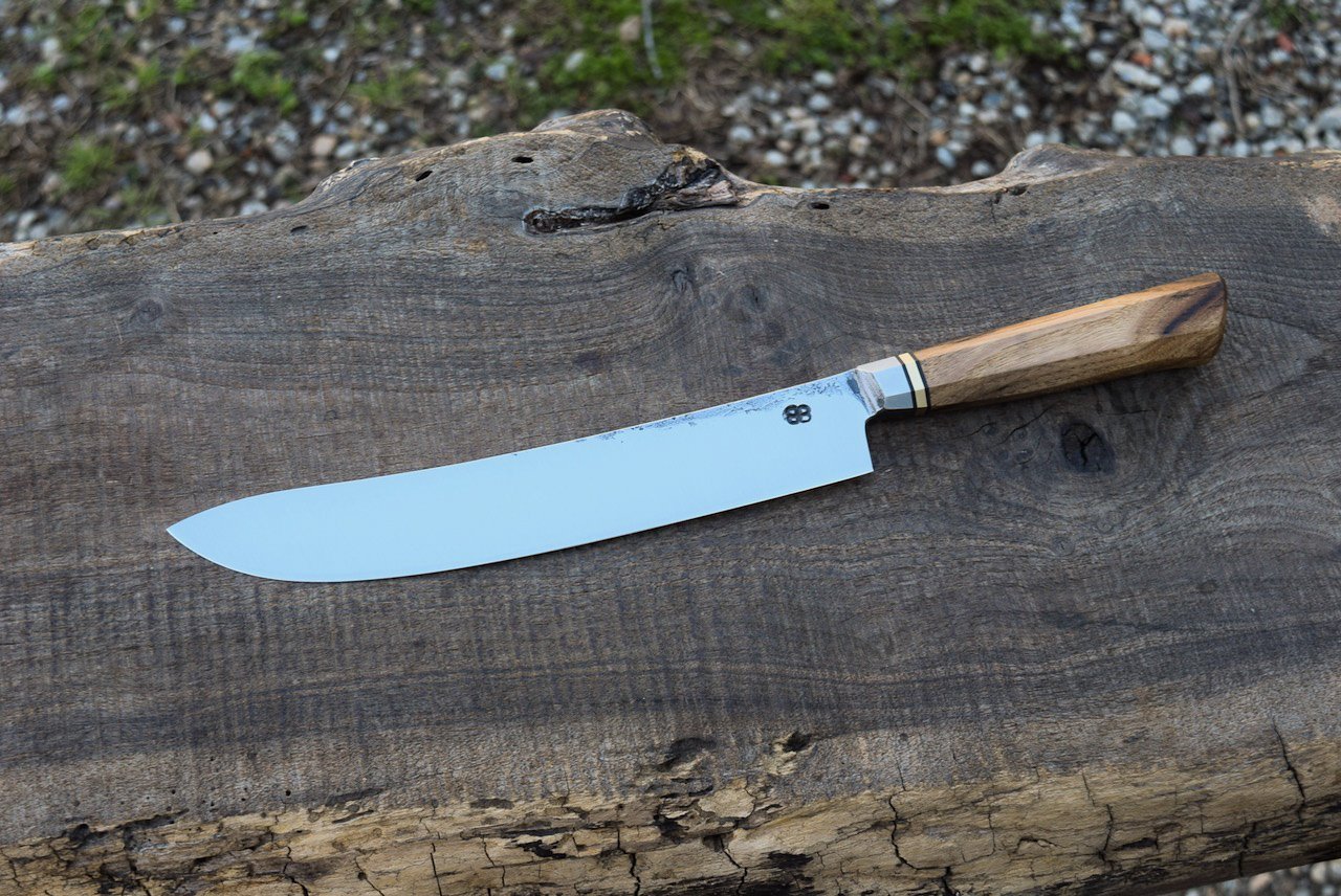  10” Integral Bullnose Butcher with Forge Finish. Westernized Octagonal Pecan Handle with Brass Spacer.  