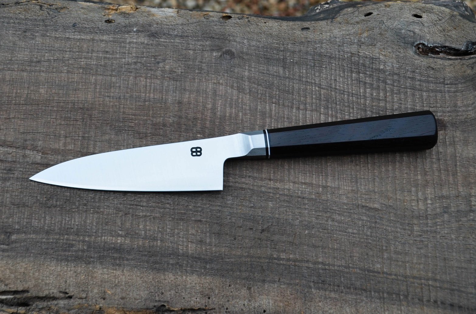  4.75” Integral Petty. Octagonal Blackwood Handle with White Fiber Spacer.  