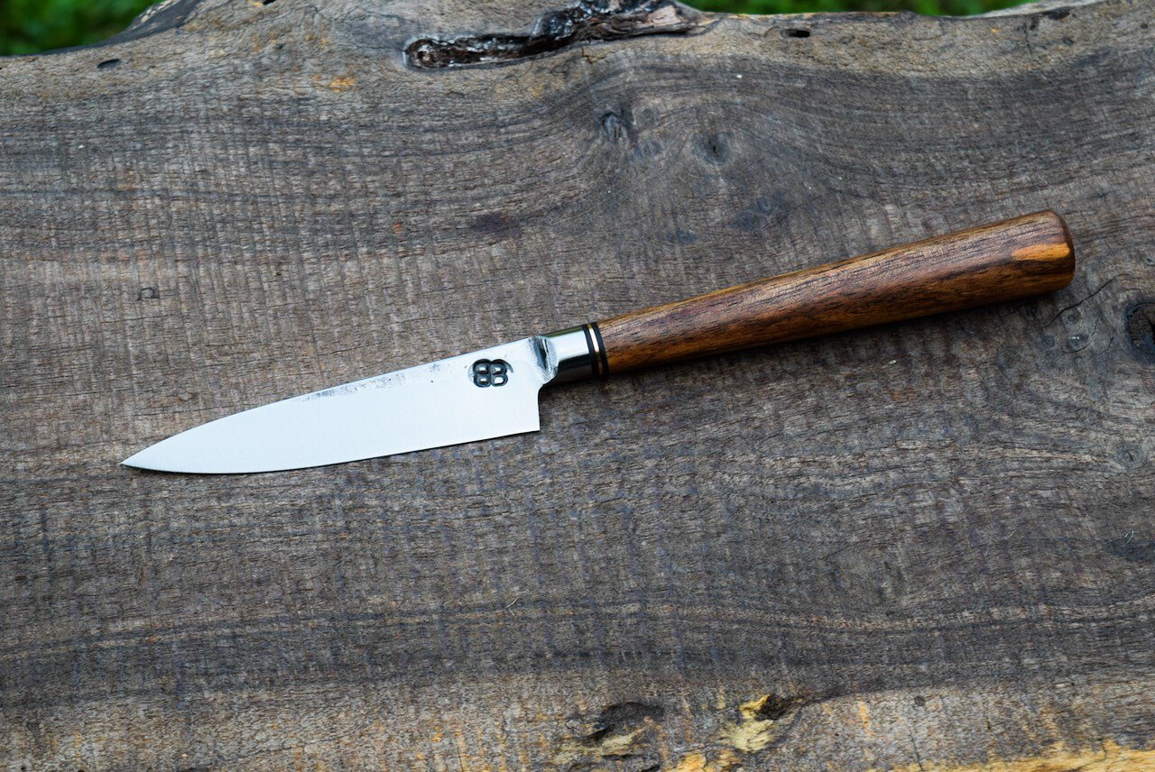  4” Integral Paring with Forge Finish. Oval Spalted Walnut Handle with Brass Spacer.  