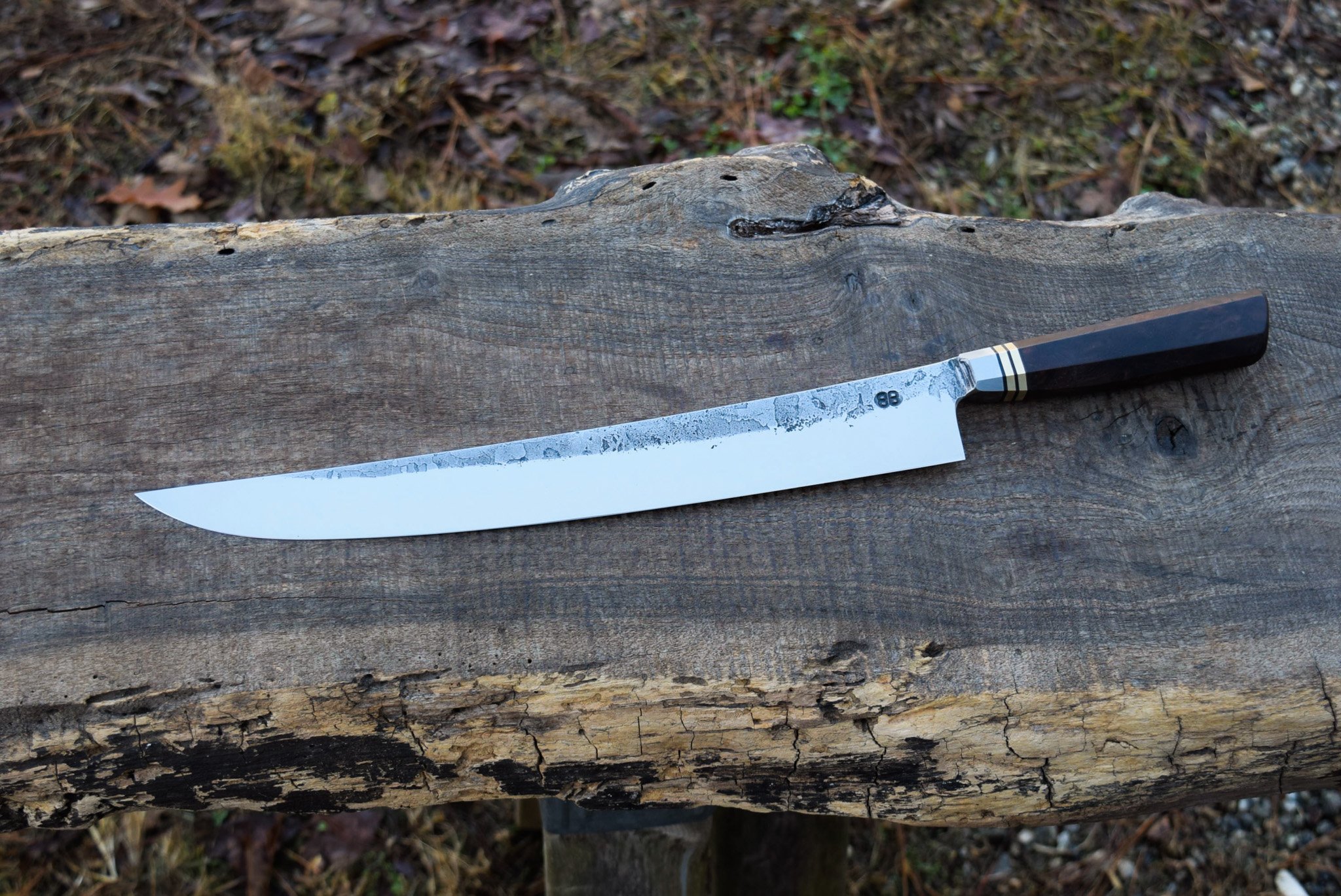  13.25” Barbecue Knife. Westernized Octagonal Integral Walnut Burl Handle with Leather and Brass spacers. 