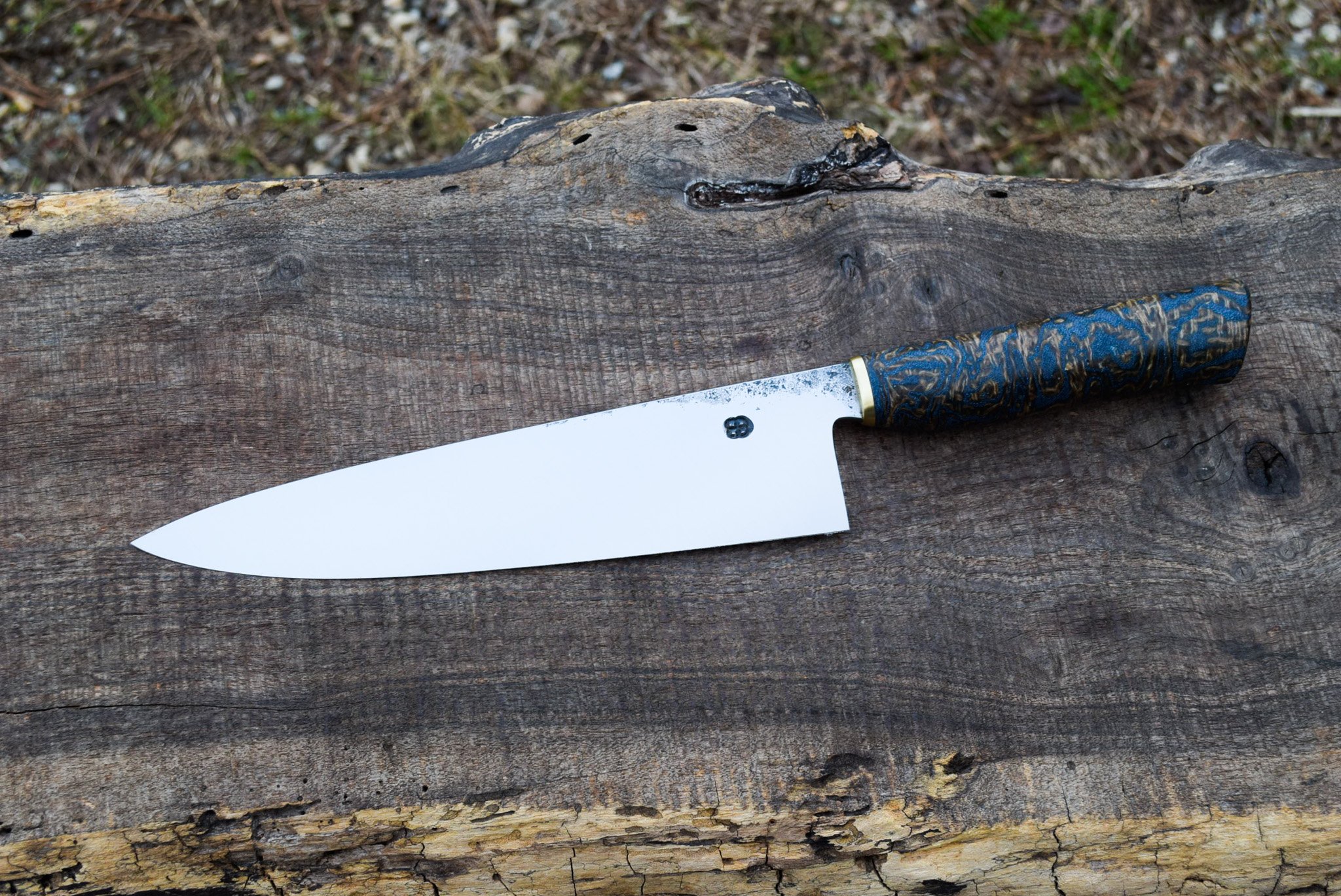  8.5" Hidden Tang Tapered Western Chef with Forge Finish. Smooth Western Coffeebag and Denim Laminate Handle with Brass Faceplate.  