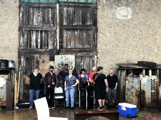 The crew ducks out of the rain in Maspeth, Queens