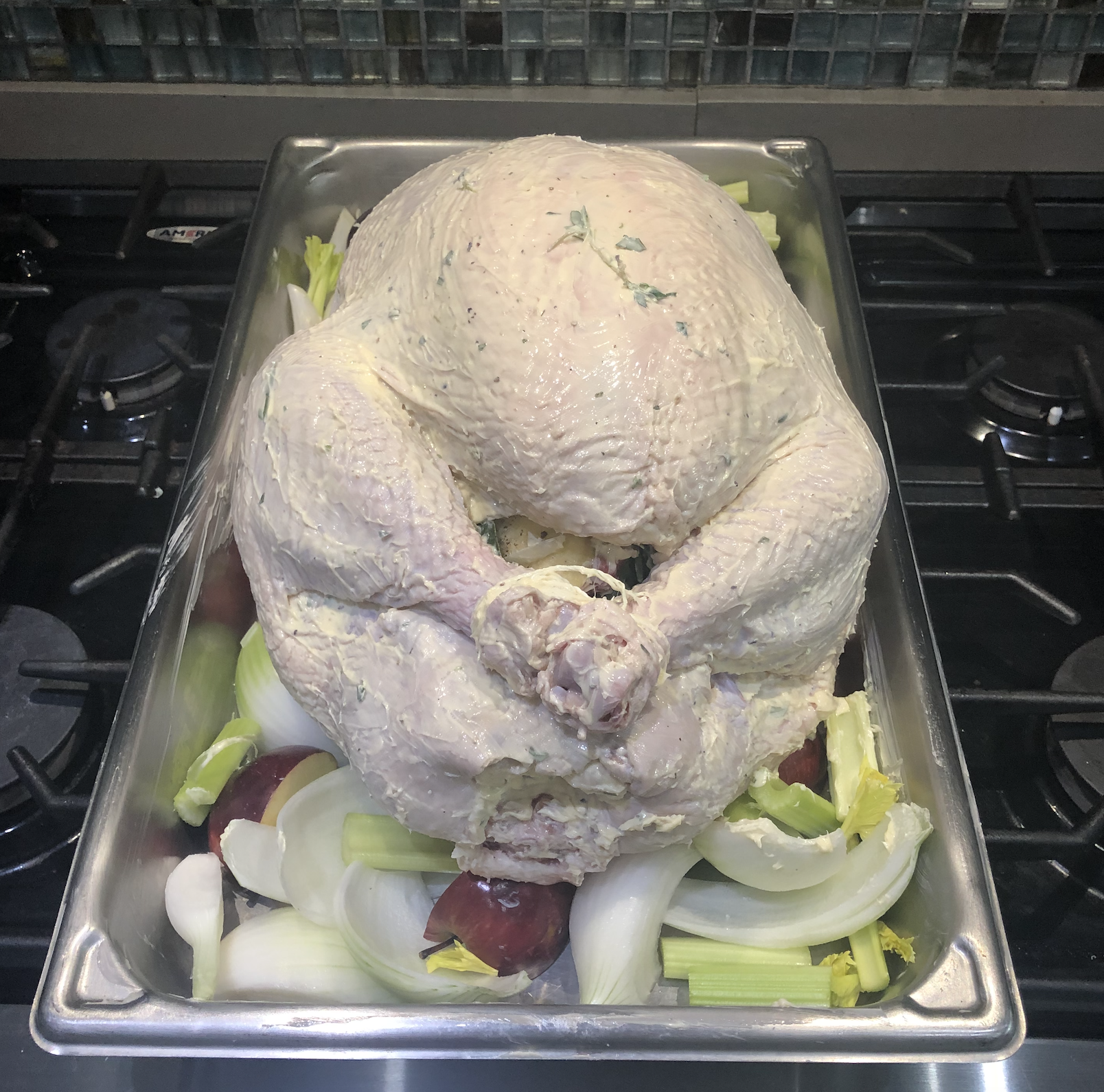 It’s easier to tuck the wings once the bird is buttered. Close the legs with kitchen twine.
