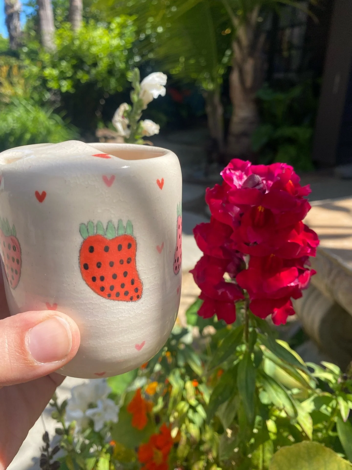 She's perfect!!! Strawberry queen travel coffee mug! This piece is so special because I hand mixed reclaim clay with purple mason stain to make purple clay. I layered the purple clay with my regular clay and when I threw it created a marble effect! 

