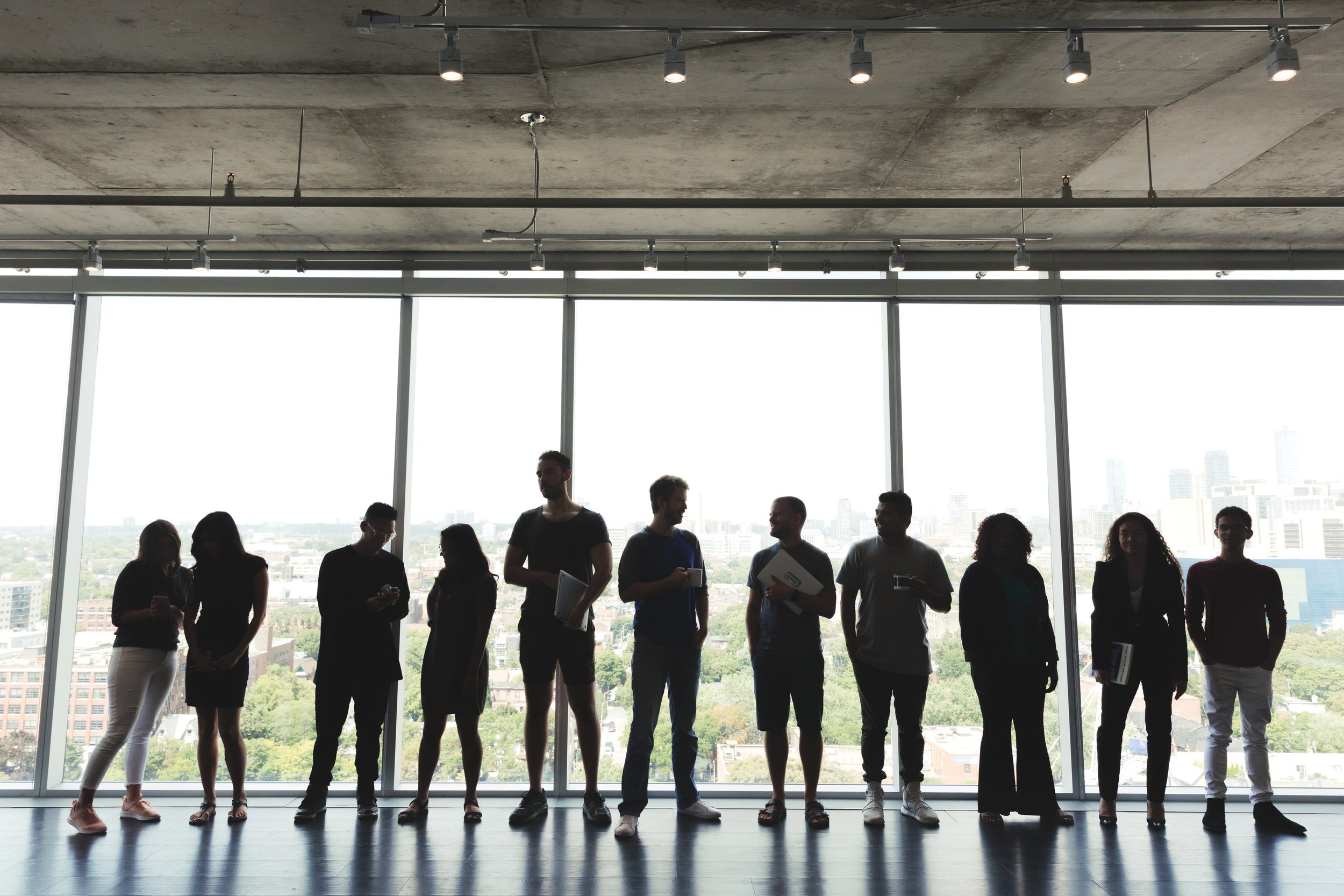 large-group-standing-in-office_4460x4460.jpg