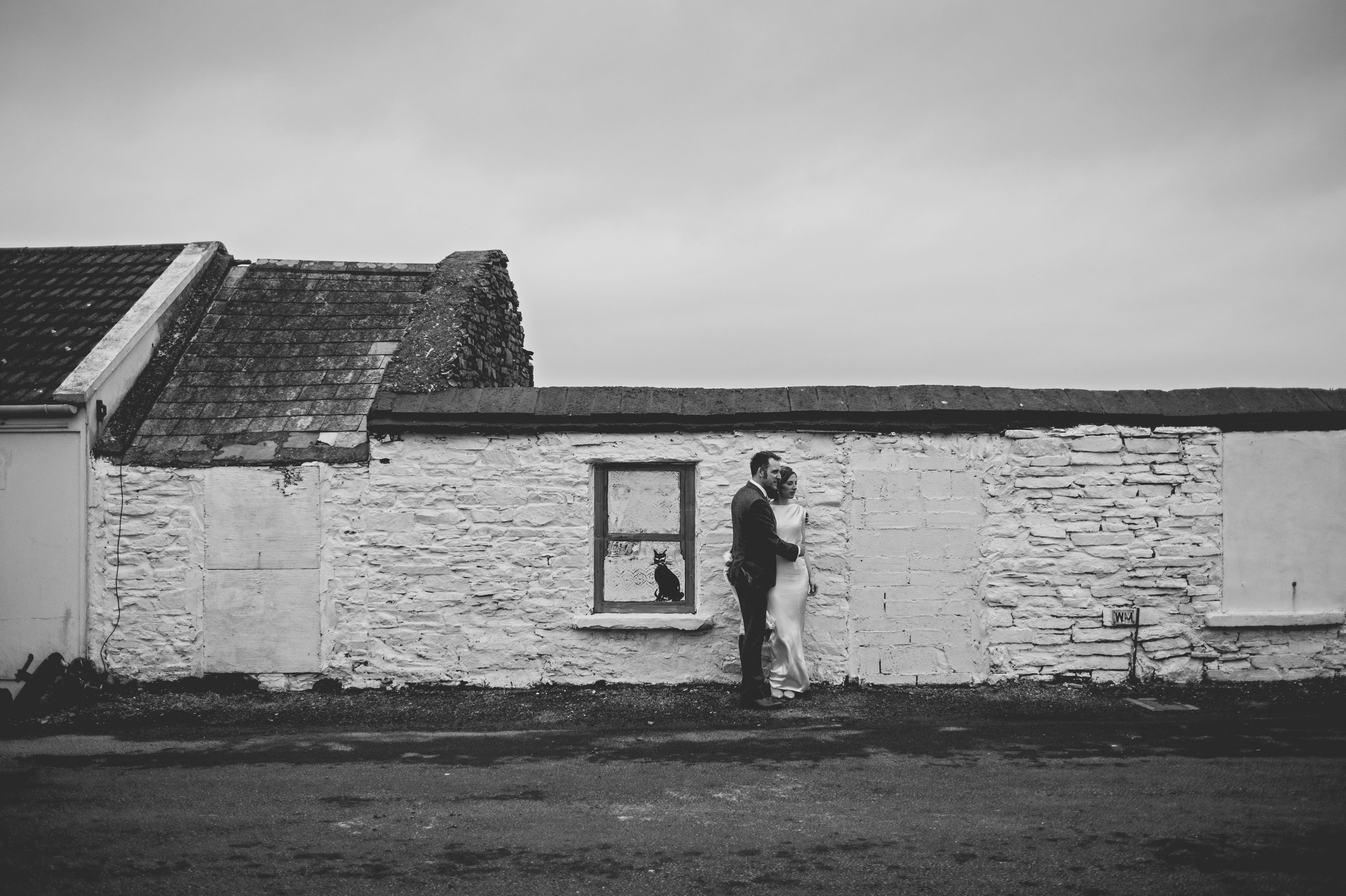 Wedding couple at old cottage