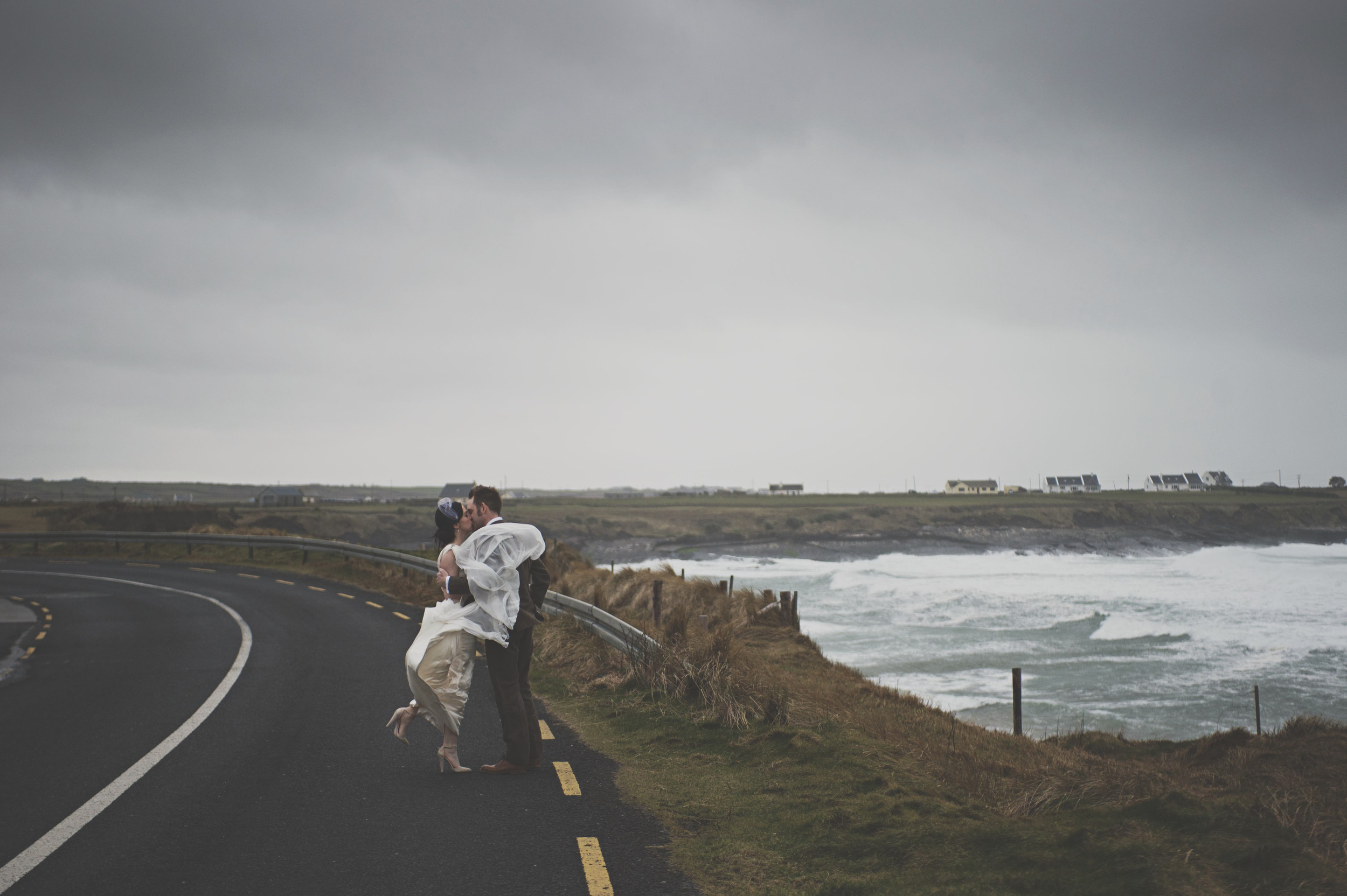 Wedding couple on coast road