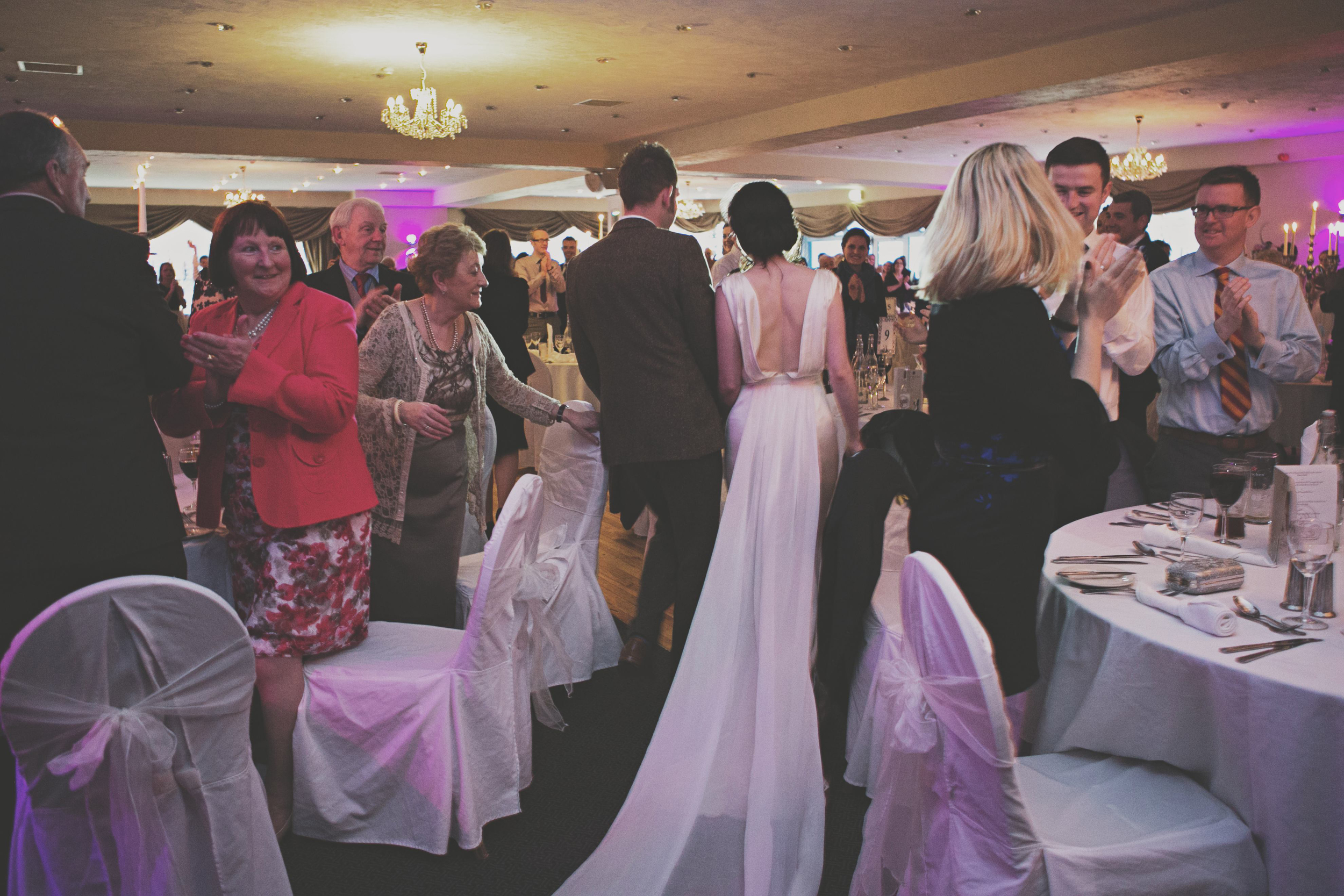 wedding couple enter their reception