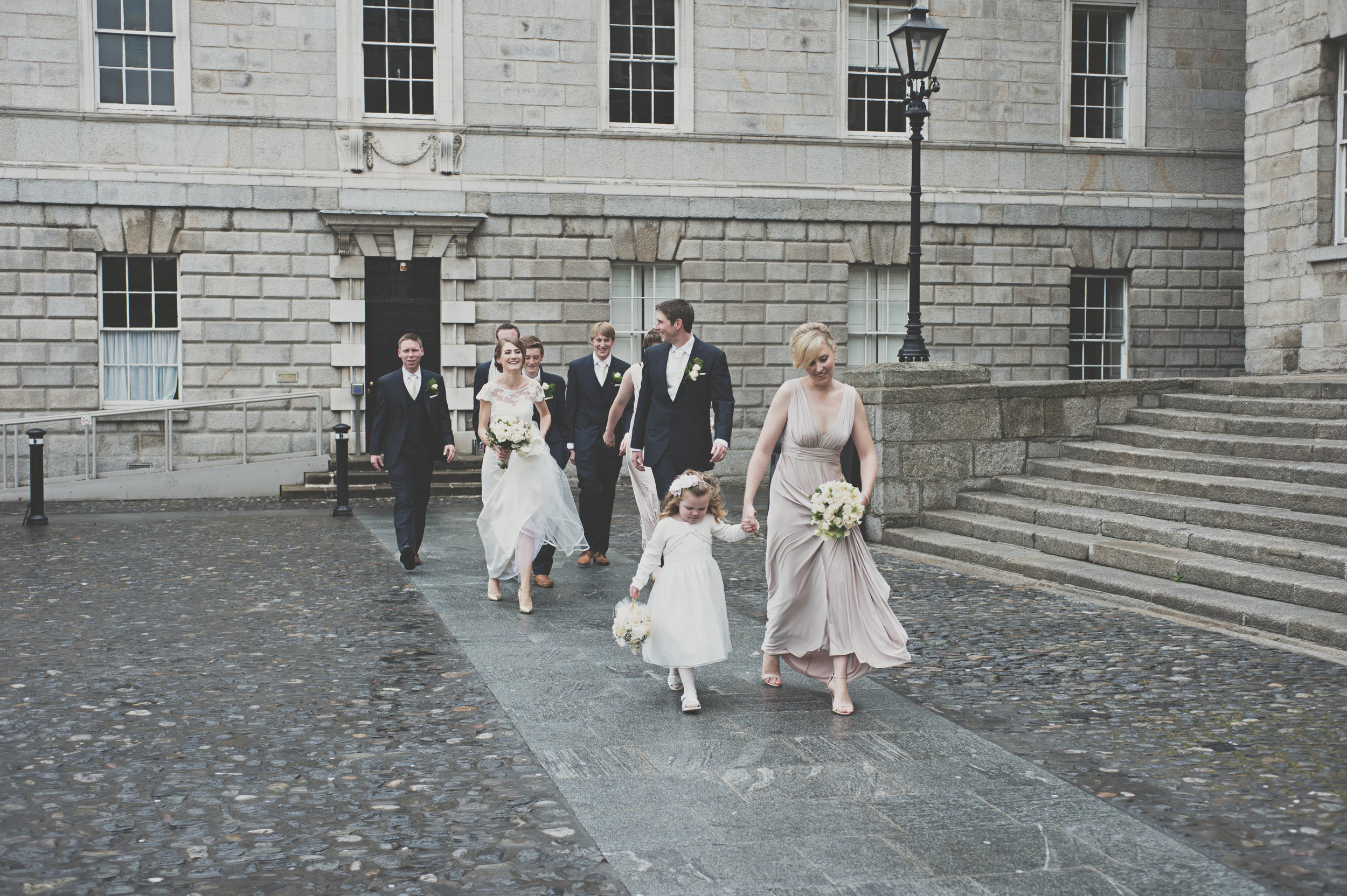 Wedding party walks through Trinity College Dublin