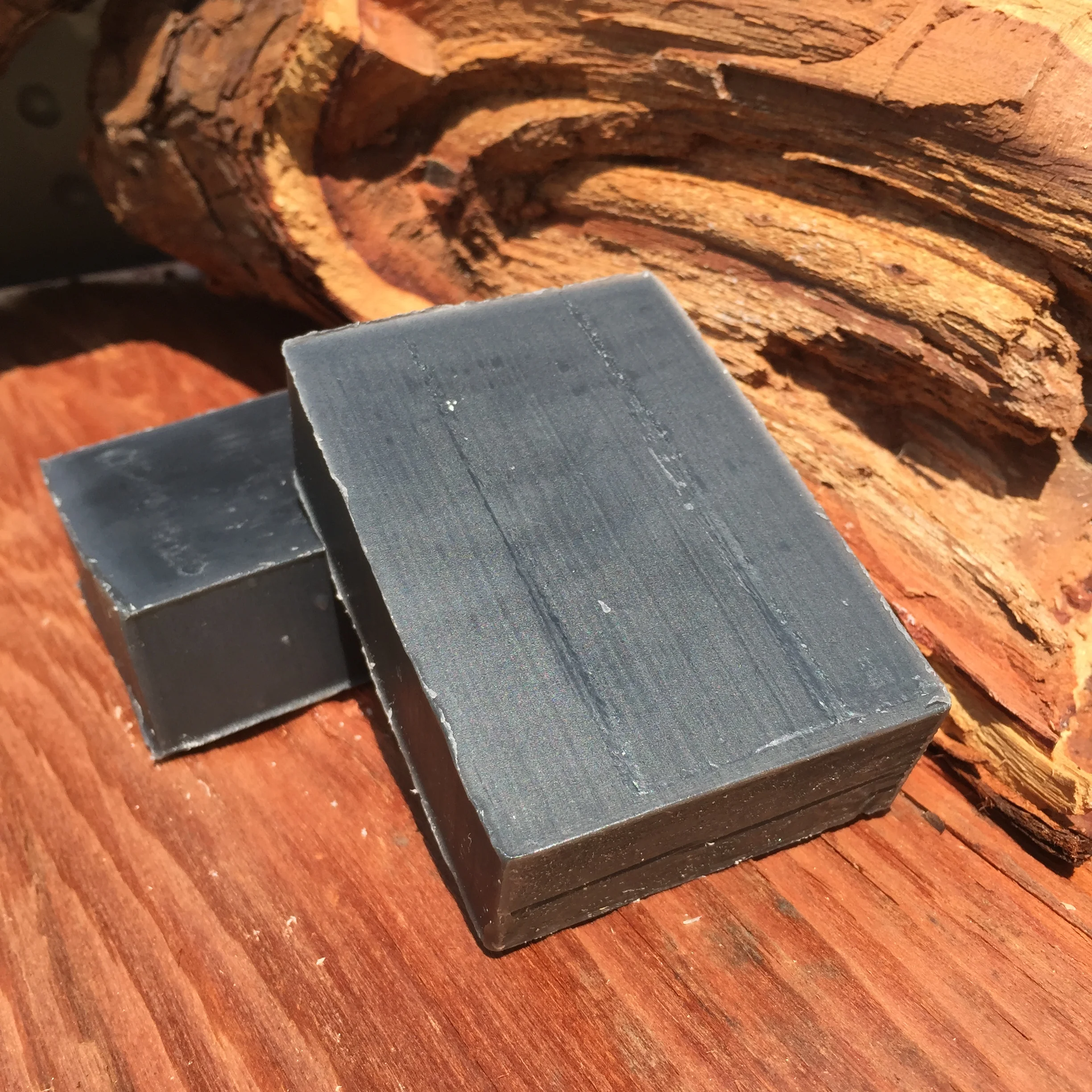     Black Magic      This amazing bar has a perfect blend of Activated Charcoal, Tea Tree, and Lavender essential oils. &nbsp;Activated Charcoal is known to pull the toxins out of your skin and dirt out of your pores. &nbsp;Tea Tree is purposed as an