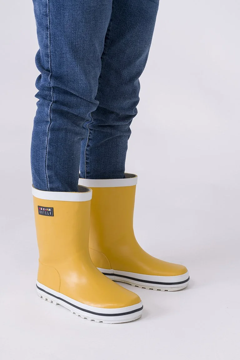 yellow rain boots.jpeg