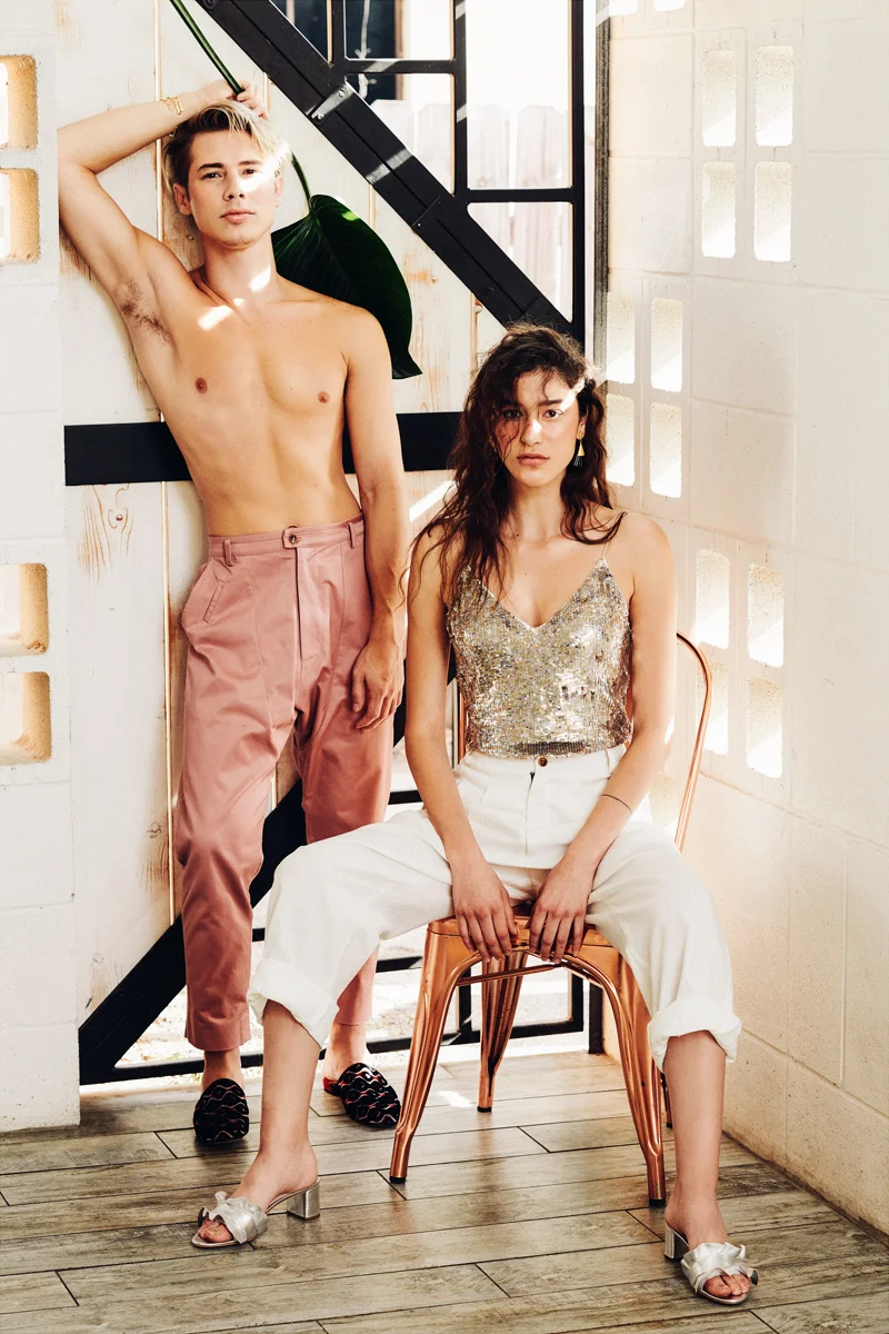 Him: pant- Edwige Pierre, bracelets- Rahya, slide- Stuart Weitzman. Her: top- Alice + Olivia, pant- Edwige Pierre, earring- Dean Davidson, heel- Loeffler Randall.