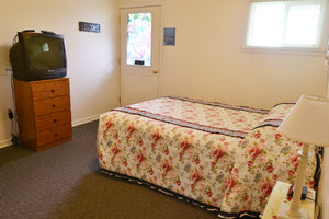 Lucky Horseshoe Room #23 - Interior Queen Bed and Entrance.JPG