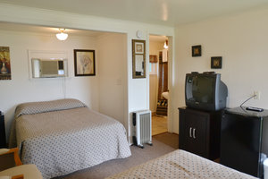 Lucky Horseshoe Room #23 - Interior Television and Full Size Bed.JPG
