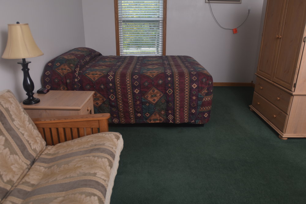Blue Spruce Motel - Room Number 12 - Interior Bed and Entertainment Center.jpeg