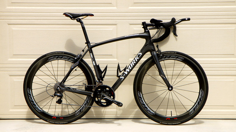 A road bike with TT bars and race wheels
