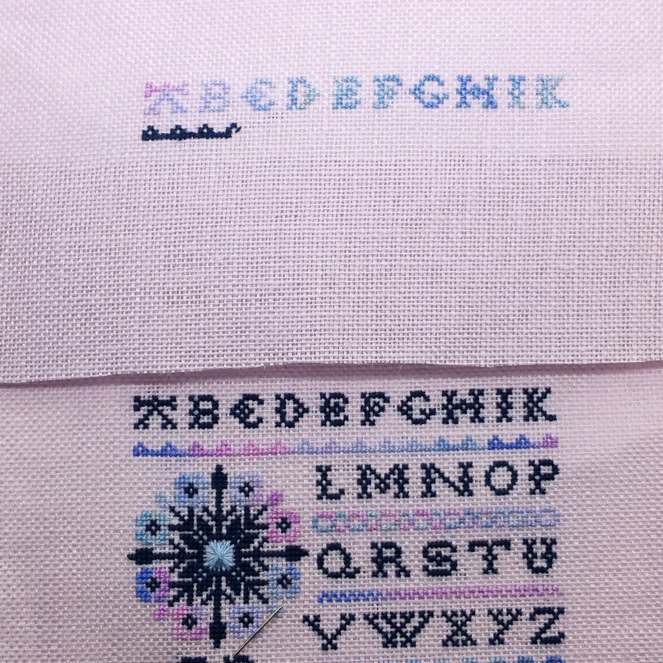 My abandoned version 2 (top), and the final version 3 (below). Not pictured: my sad little version 1 with a single letter stitched :)