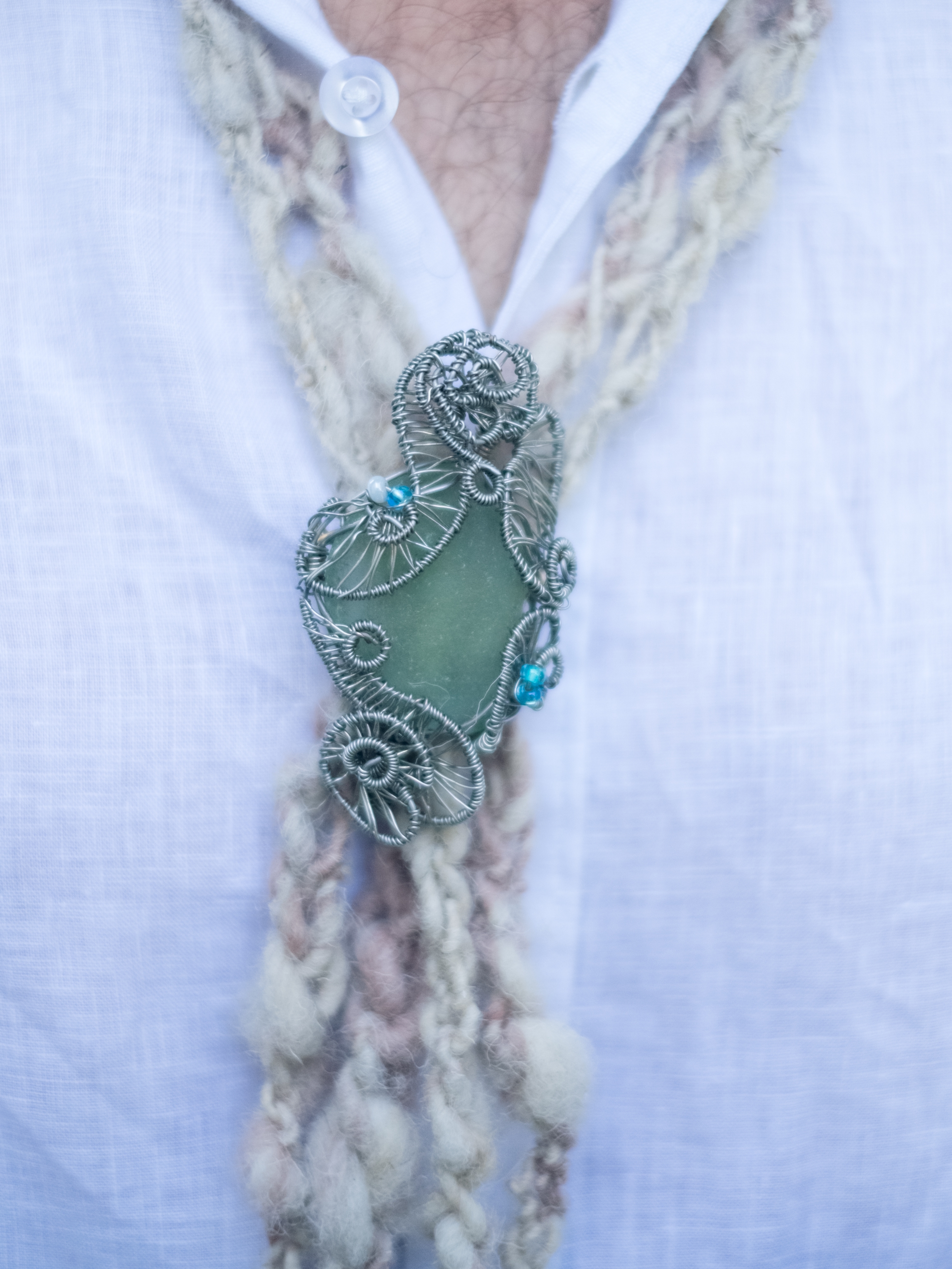 Sean's bolero tie, wool with sea glass clasp made by his mother.